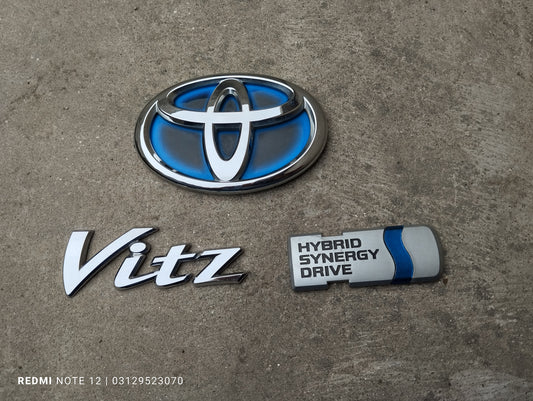 Toyota Vitz OEM hybrid Rear Emblem set  Rear TrunkMonogram Logo  Complete Set Genuine Japanese OEM 75442-52520